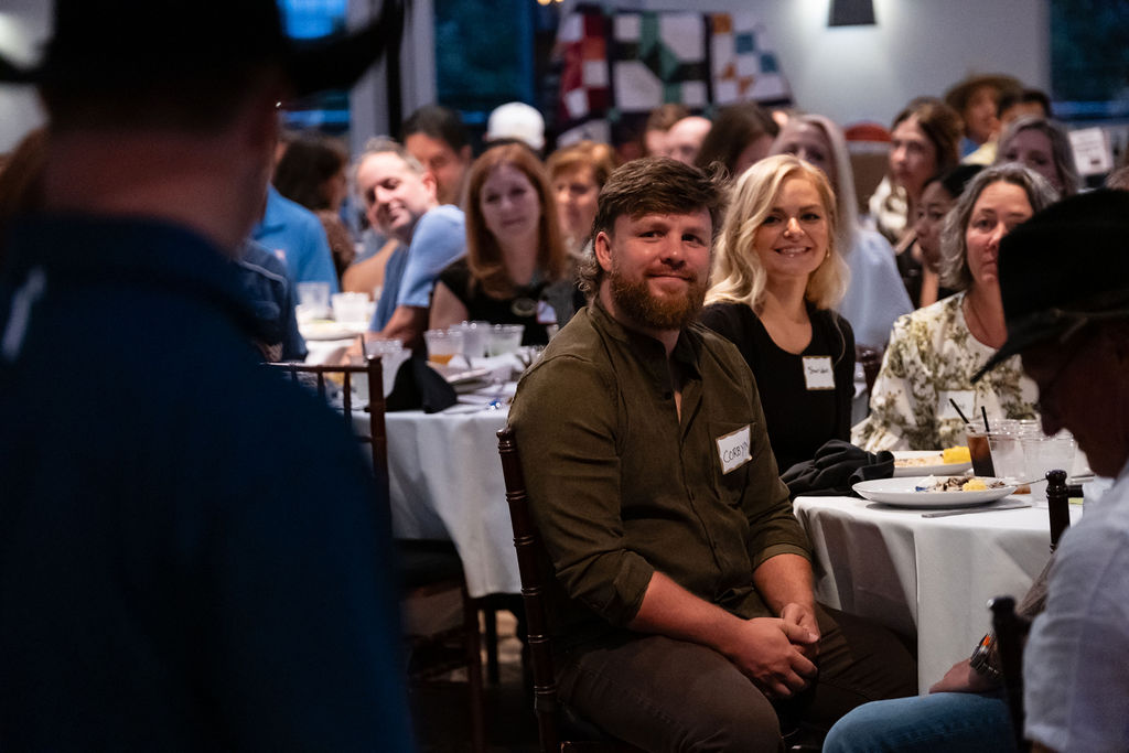 Guests at a table during the dinner program