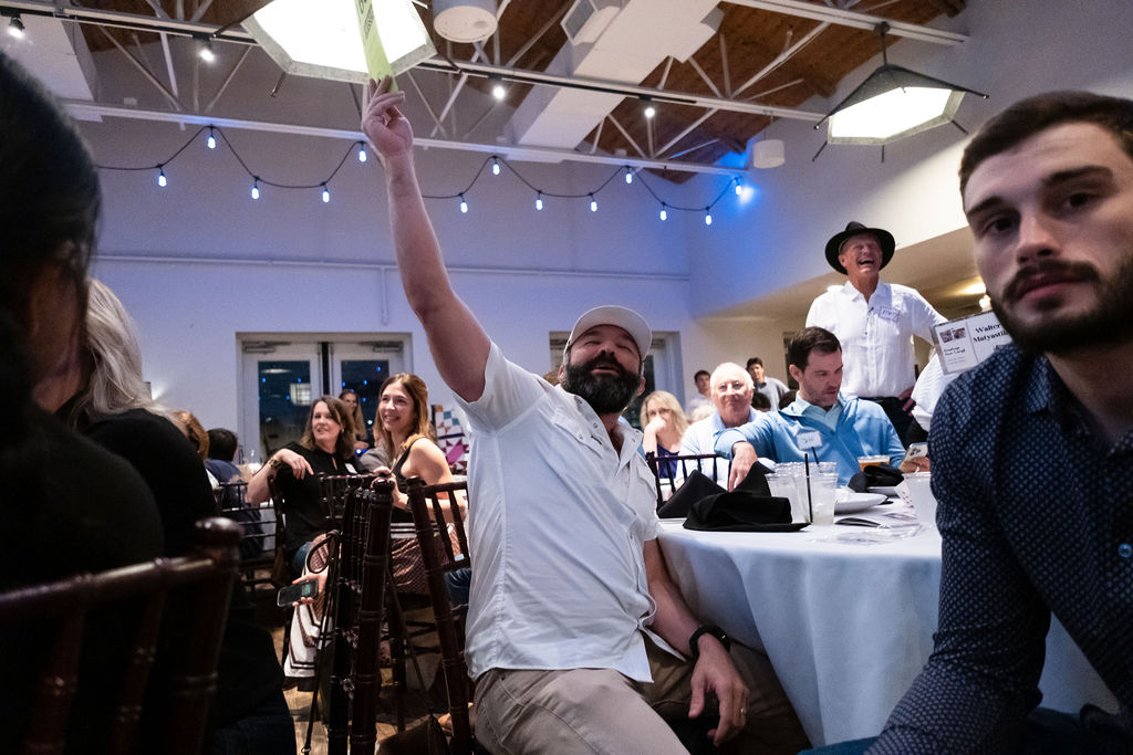 A paddle goes up during the live auction