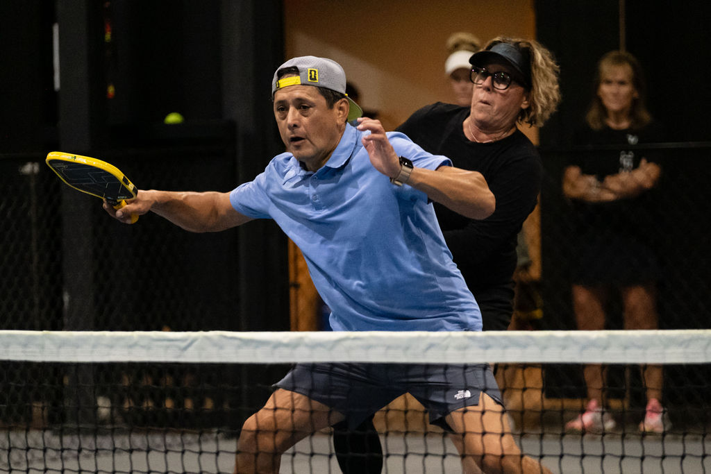 A player lunges for a low ball at Picklr West Fort Worth
