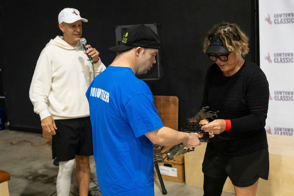 A pro coaching a player during the Beat the Pro challenge