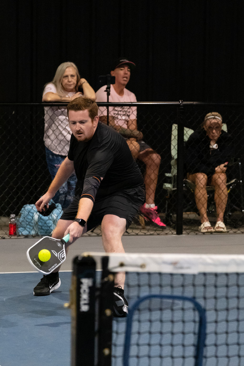 A two-handed backhand during bracket play