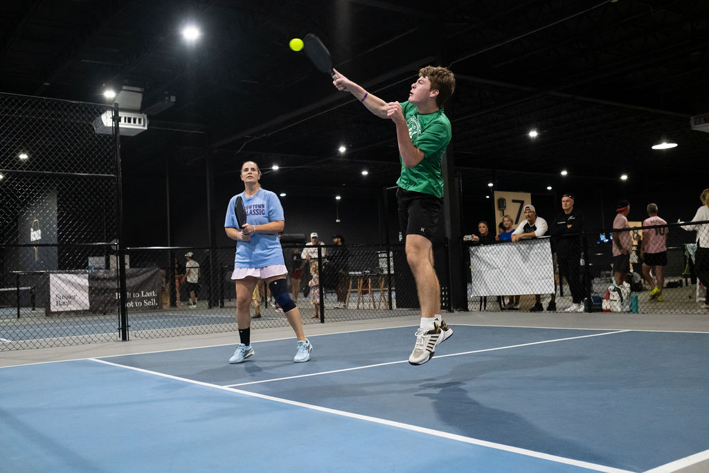 A player stretches to keep a point alive