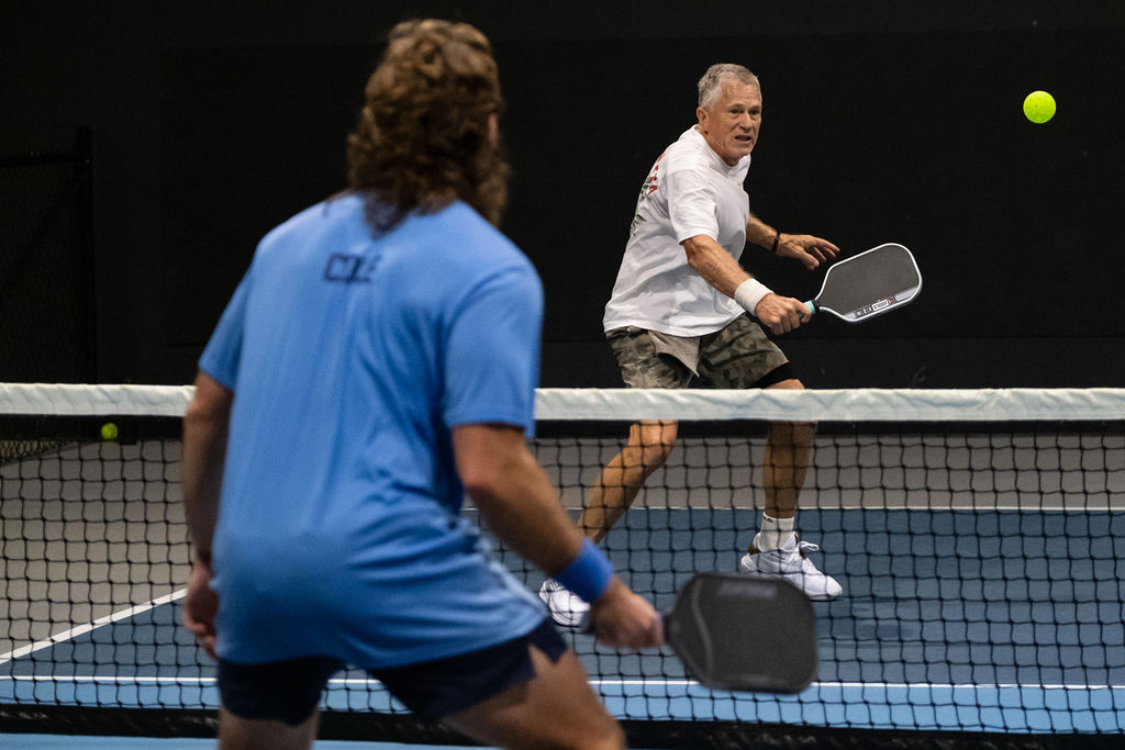 Doubles rally on the Picklr courts